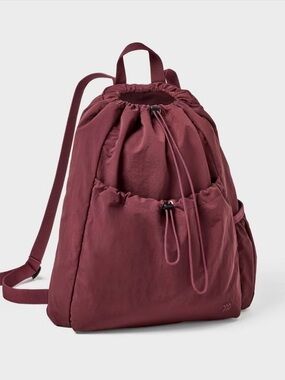 Burgundy all in motion water resistant pull string backpack.
New